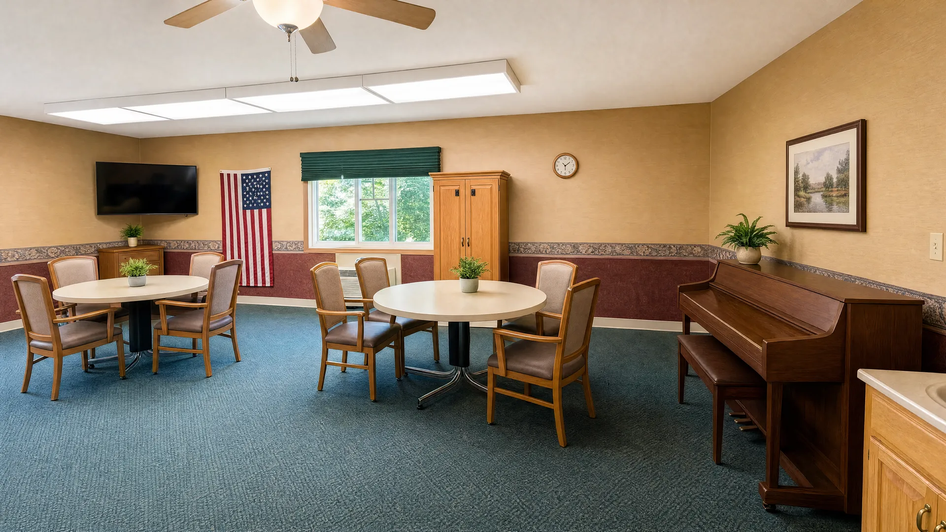 Activity room with round tables, chairs and a piano at Rehabilitation Center of Independence