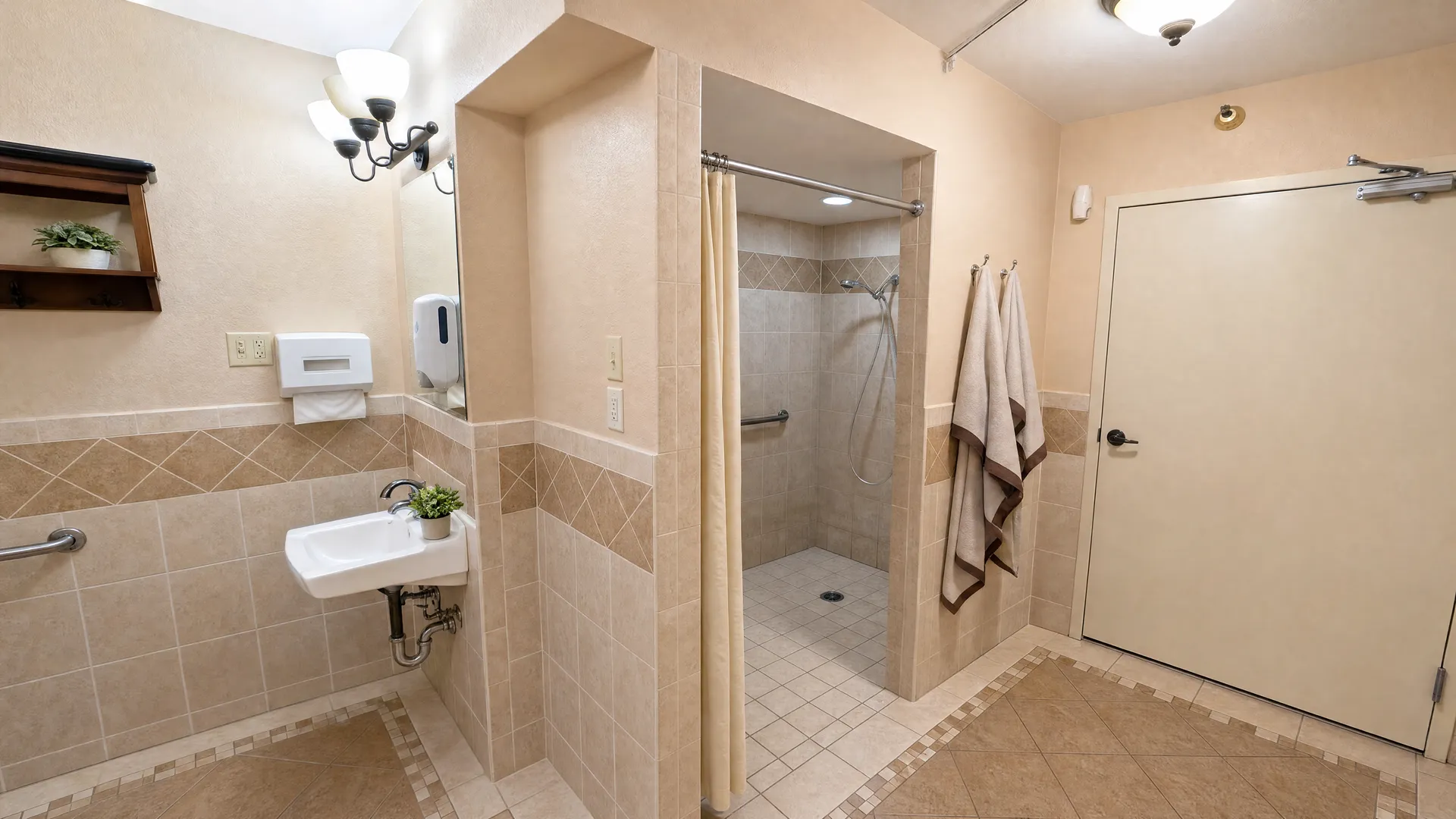 Accessible roll-in shower room with grab bars and a wall-mounted sink at Rehabilitation Center of Independence